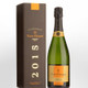 Veuve Clicquot Vintage Champagne: A bottle of Veuve Clicquot vintage champagne, 2015, displayed next to its brown box packaging. The bottle features a gold and black label with the brand name prominently shown. Veuve Clicquot Vintage Champagne: A bottle of Veuve Clicquot vintage champagne, 2015, displayed next to its brown box packaging. The bottle features a gold and black label with the brand name prominently shown.